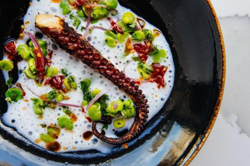 a plate of food with corn snakes and vegetables at Kimpton Hotel Arras by IHG in Asheville