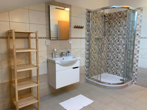 a bathroom with a sink and a shower at Kašperky 440 in Kašperské Hory