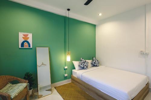 Ein Bett oder Betten in einem Zimmer der Unterkunft Yindee Home & Cafe