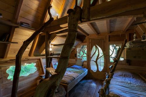 Postel nebo postele na pokoji v ubytování L'Arbre à Cabane