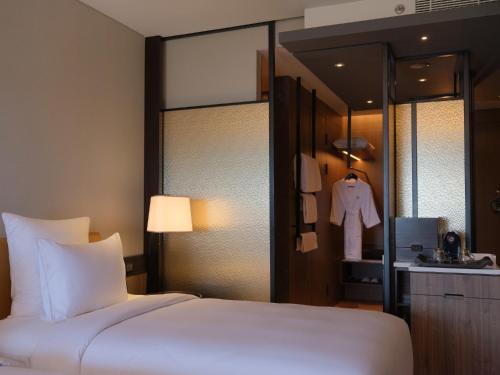 Cama o camas de una habitación en Pullman Bandung Grand Central