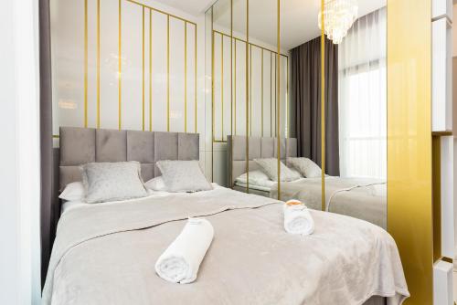 Voodi või voodid majutusasutuse Browary Warszawskie City Center by Renters Prestige toas