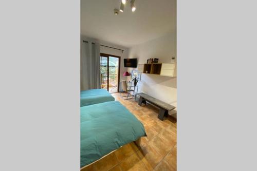 A bed or beds in a room at Risco de Zula