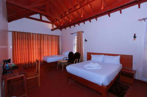 Postel nebo postele na pokoji v ubytování Mtoni Resort, Naro moru