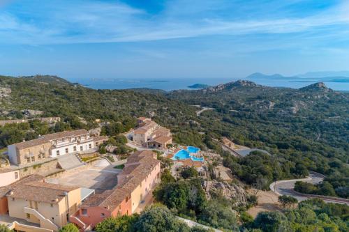an aerial view of a house on a hill at Borgo Smeraldo Villas in Arzachena
