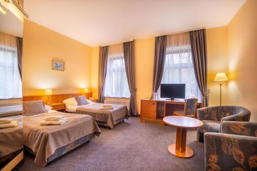 Postel nebo postele na pokoji v ubytování Hotel Fenix