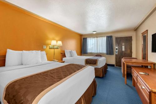 Cama o camas de una habitación en ASAM Hotel