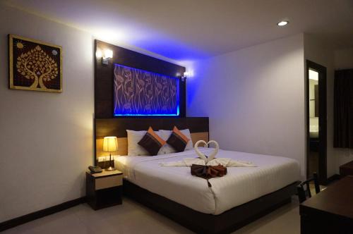 Cama o camas de una habitación en Patong Mansion - SHA Certified