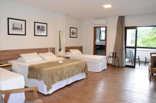 Posteľ alebo postele v izbe v ubytovaní Hotel Metrópole