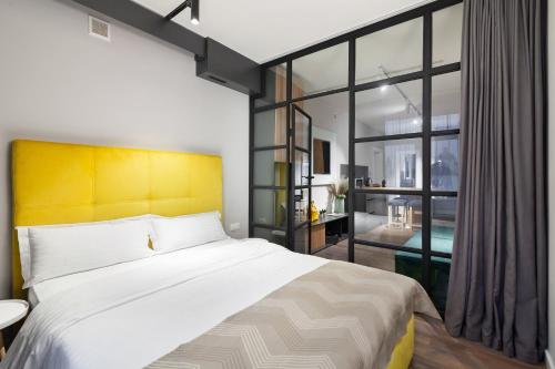 Postel nebo postele na pokoji v ubytování AUSTRIAN APART HOTEL