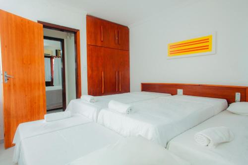 Säng eller sängar i ett rum på Apartamento Condomínio Jerusalém