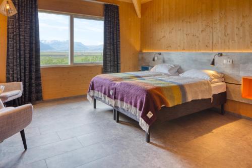 En eller flere senge i et værelse på Brunnholl Country Guesthouse