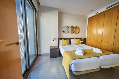 מיטה או מיטות בחדר ב-Bonavista Apartments - Virreina