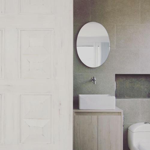 a bathroom with a sink and a mirror on the wall at Moonshine Boutique Hostal in Cali