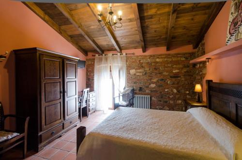 Ένα ή περισσότερα κρεβάτια σε δωμάτιο στο Hotel Rural Cerro Principe