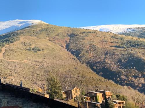 a mountain with a train in front of it at Casa Rural Pirineu Nevà in Nevà