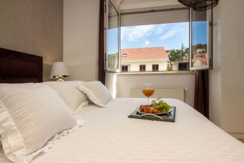 Ένα ή περισσότερα κρεβάτια σε δωμάτιο στο Apartments Satis