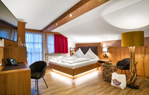 Säng eller sängar i ett rum på Wander- und Aktivhotel Adam Bräu