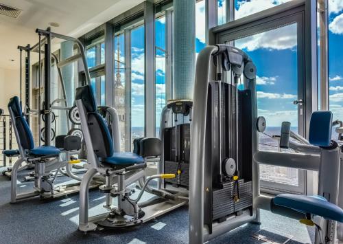 a gym with treadmills and elliptical machines at InterContinental Warszawa by IHG in Warsaw