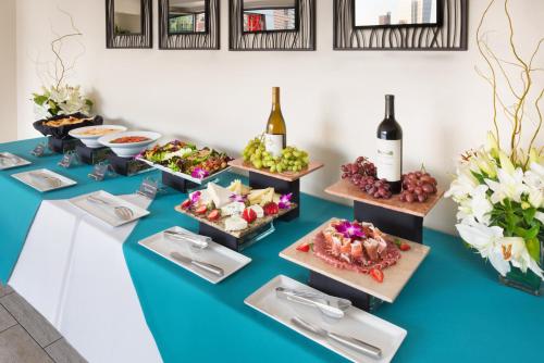 a buffet of food and wine on a table at Hotel Indigo San Diego - Gaslamp Quarter by IHG in San Diego