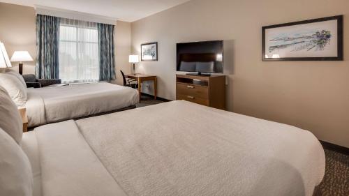 Ένα ή περισσότερα κρεβάτια σε δωμάτιο στο Best Western Plus Executive Residency Marion