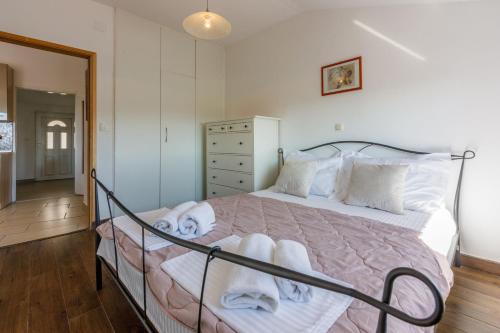 Posteľ alebo postele v izbe v ubytovaní Apartments Franka
