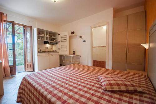 Residence Le Grazie Estにあるベッド