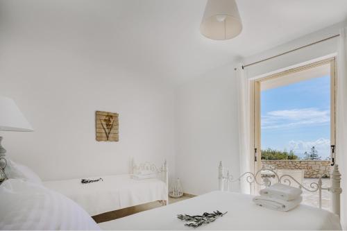Ένα ή περισσότερα κρεβάτια σε δωμάτιο στο Villa Kyparissi