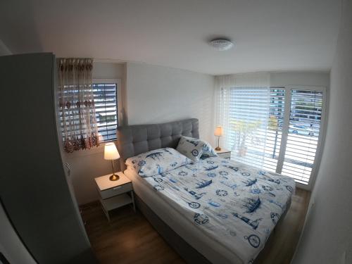 Ένα ή περισσότερα κρεβάτια σε δωμάτιο στο The Golf apartments