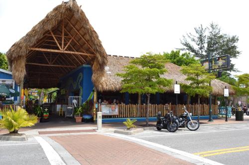 a building with two motorcycles parked in front of it at Siesta Key Beach 665 #1 in Siesta Key