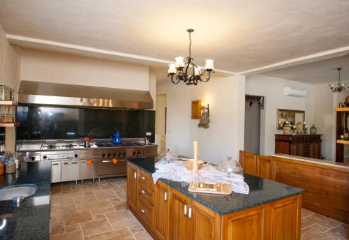 a large kitchen with a island in the middle at Room in BB - Exclusive and Romantic Boutique Hotel in Fethiye