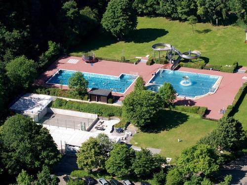 an aerial view of a house with a swimming pool at Villa Im Bongert - Tor zum Nationalpark Eifel in Hellenthal