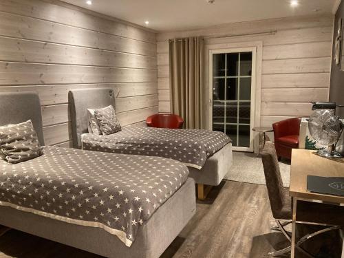 Postel nebo postele na pokoji v ubytování Lapland Lodge