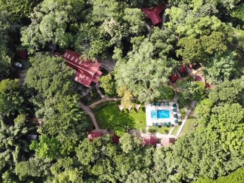 an overhead view of a house in the forest at Cabañas Kin Balam Palenque in Palenque