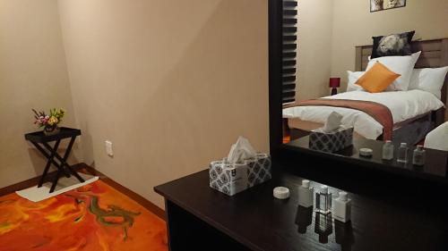 Ένα ή περισσότερα κρεβάτια σε δωμάτιο στο SVH Bush Lodge