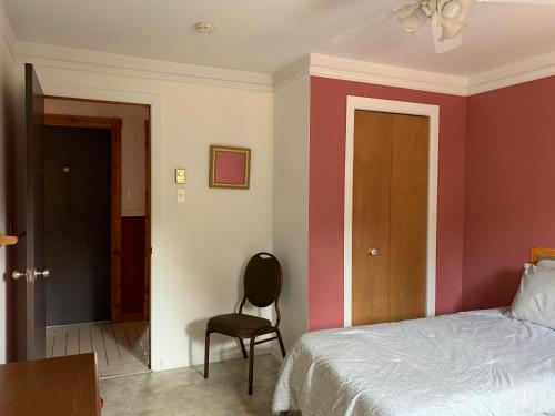 Voodi või voodid majutusasutuse L'Auberge Refuge du Trappeur toas