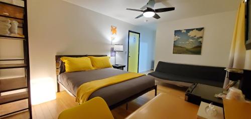 a bedroom with a bed and a ceiling fan at The Mammoth Inn in Mammoth Lakes