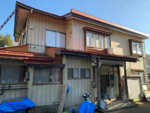 a house being constructed with the front of it at Minpaku Hanaya in Nozawa Onsen