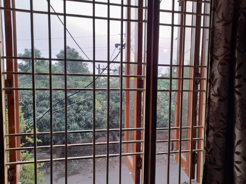 an open window with a view of a train track at Govind Niwas Home Stay in Gwalior