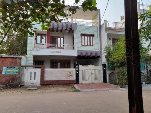 a house with a gate in front of it at Govind Niwas Home Stay in Gwalior