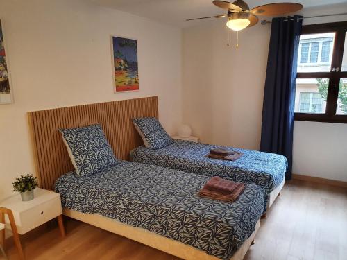 a small bedroom with a bed and a couch at Oranger in Nice