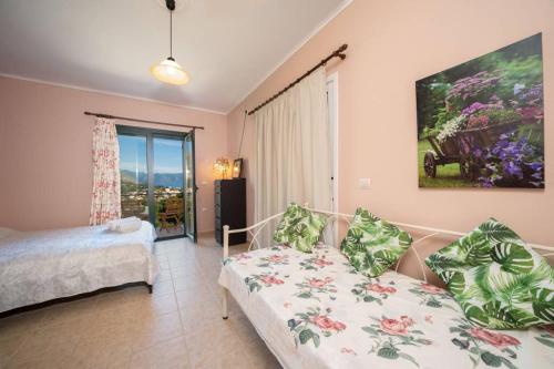 Ένα ή περισσότερα κρεβάτια σε δωμάτιο στο Villa Hara