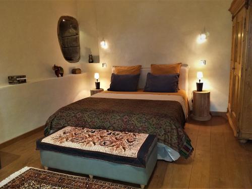 a bedroom with a large bed in a room at Domaine des Marequiers chambre Silène in Saint-Germain-du-Teil
