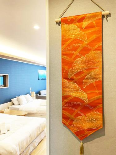 Ένα ή περισσότερα κρεβάτια σε δωμάτιο στο HOTEL CLA-SS HIROSHIMA-DOBASHI