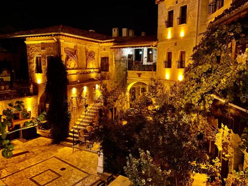 an image of a building at night with lights at Sofa Hotel in Avanos