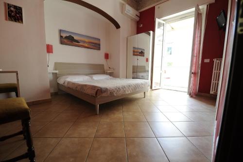 a bedroom with a bed in the middle of a room at B&B Calcio Storico in Florence