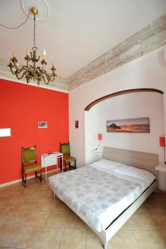 a bedroom with a bed and a table and chairs at B&B Calcio Storico in Florence