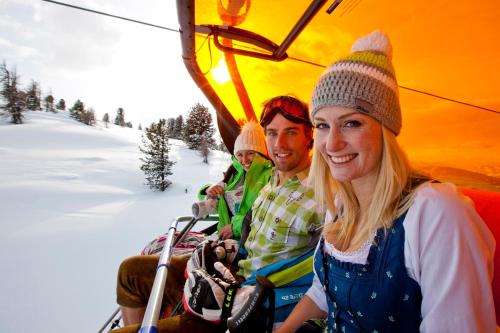 a group of people riding on a ski lift at Gästehaus Biobauernhof Mandl in Murau