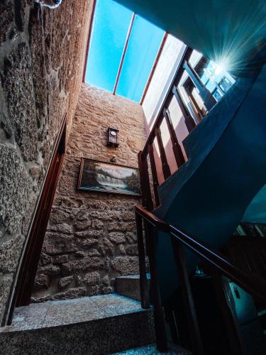 a stairway leading up to a building with a window at Casa da Tanquinha in Beiral do Lima
