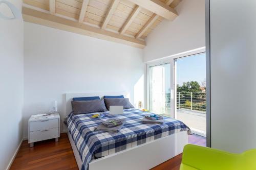 En eller flere senger på et rom på Design Villa in Piedimonte Etneo